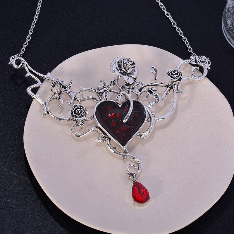 Blackened Silver Heart Necklace with Blood-Red Garnet & Thorned Rose Details - Dark Romantic Jewelry for Alternative & Mystic Style